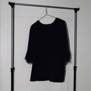 Black shirt with feathered sleeves